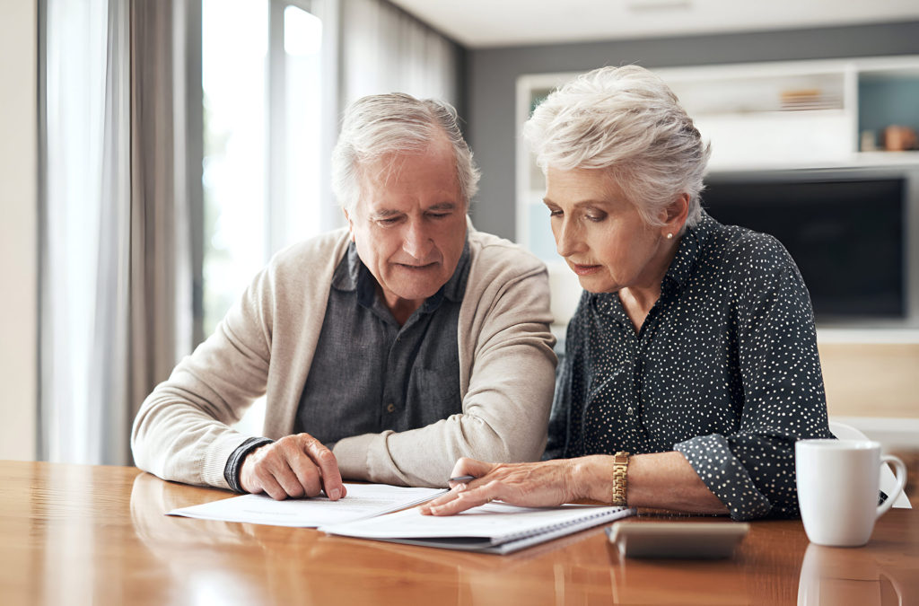 couple reviewing a living trust with an attorney